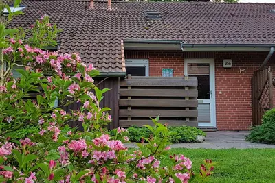 Image de Vacation home close to the beach in a green vacation village with fireplace, terrace and barbecue