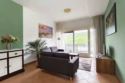 Image de Discover Apartment Wijde Blick 1. 11 in Callantsoog for 4 persons. Close to beach and center, with two bedrooms, bathroom, kitchen, living room and balcony. Enjoy hiking, biking, water sports and local restaurants.