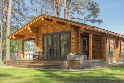 Image de The house is located in a quiet area, surrounded by forest pines.