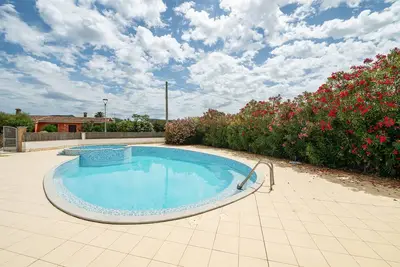 Image de Maison de vacances 'Villetta 110 e lode' avec piscine
