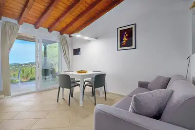 Image de Appartement 'Appartamento Lato Olbia' avec vue sur la mer, jardin partagé et climatisation