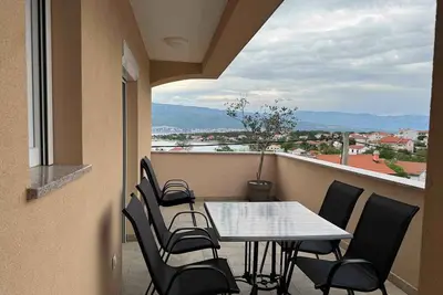 Image de Appartement de vacances avec climatisation et vue latérale sur la mer