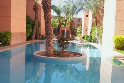 Image de Homerez - Appartement confortable à Marrakesh avec piscine partagée.