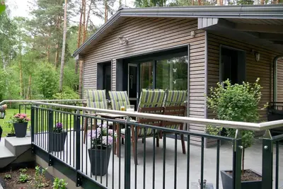 Image de Maison de vacances 'Am Kiefernweg 1' avec vue sur lac, terrasse privée et jardin privé