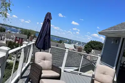 Image de Walk to town! Spacious family home w/large deck boasting ocean view and sunsets!