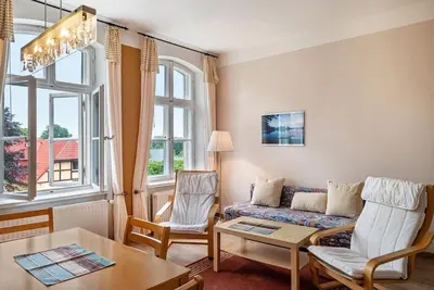 Image de Appartement 'Ferienwohnung 7' avec terrasse et jardin partagés
