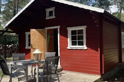 Image de Cabine 'Ferienhaus Am Mellensee 2' avec terrasse privée et jardin privé