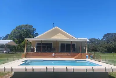 Image de A beautiful new 5 bedroom farmhouse with an in-ground pool surrounded by nature