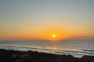 Wake up to gorgeous sunrises and sea views upon a wooden balcony.