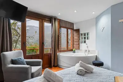 Image de Appartement \"El Ablanu, Jacuzzi Y Vistas\" avec vue sur les montagnes, terrasse privée et Wi-Fi