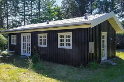 Image de Maison de vacances pour 6 a Blokhus-By Traum