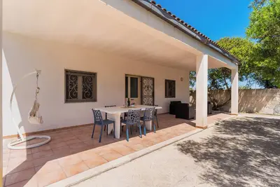Image de Maison de vacances 'Villa Iris Punta Prosciutto' avec vue sur la mer, terrasse et climatisation