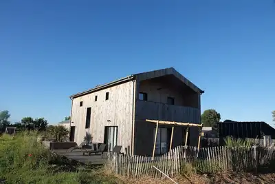 Image de Maison bois, Les Conches 10 pers. Proche plage, spot surf, forêt, piste vélo.