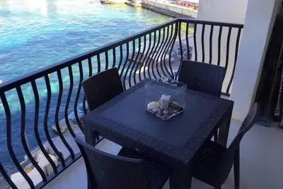 Image de Discover the charm of coastal living in this stunning sea view apartment.