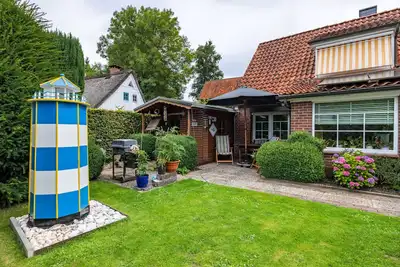 Image de Maison de vacances 'Deichkate Deichwinkel' avec terrasse partagée, jardin partagé et Wi-Fi