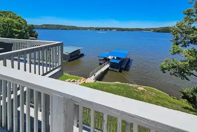 Image de Remodeled panoramic lake view home w/ dock, trailer parking