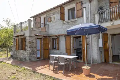 Image de Petite maison 'Rustico E Casale' avec vue sur la mer, terrasse privée et Wi-Fi