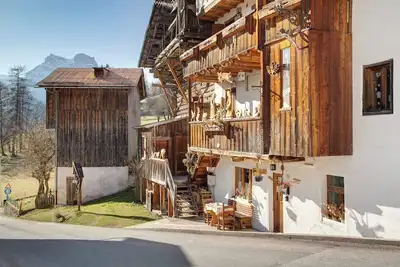 Image de Appartement 'Le Cœur des Dolomites' avec vue sur la montagne, terrasse privée et jardin privé