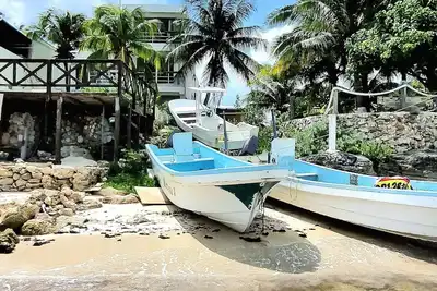 Image de On very private beach, top views apartment with a small reef and coconut trees