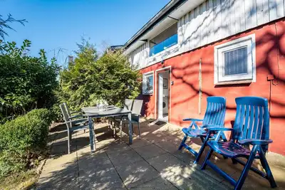 Image de Appartement 'Ferienhaushälfte Haus Rostock' avec terrasse, jardin partagé et Wi-Fi