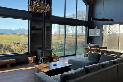 Image de Bathed in sunshine with stunning mountain views, relax in luxury after a ski.