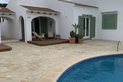 Image de Appartement 'N 6 Cala Macarelleta' avec piscine partagée, Wi-Fi et climatisation