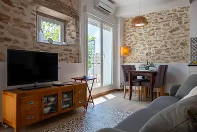 Image de Appartement cosy avec jardin, Bbq, A/C, wifi, parking, à 600m de la plage