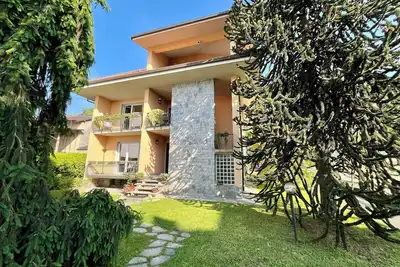 Spacious 2-bedroom apartment with garden in Arona\nCIN: It003008c2oozk44vn