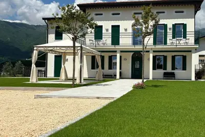 Image de Casa Titti Polcenigo entire housing with a view of Friulian hills.