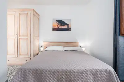 Image de Chambre 'Camera 1s' avec terrasse partagée et balcon