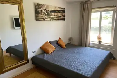 Image de Shared living room, open kitchen, wellness, 2 double bedrooms with bathrooms.