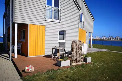Image de Koje 23 - 1. Reihe am Wasser, Kamin, Dusch, Waschmaschine, Terrasse, Stellplatz