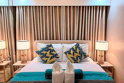 Image de 2 Bedrooms and 2 Bath with Balcony, pool view at Shore Residences near Moa Pasay
