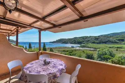 Image de Appartement 'Mono4Posti Vista Mare Il Portolano' avec vue sur la mer, Wi-Fi et climatisation