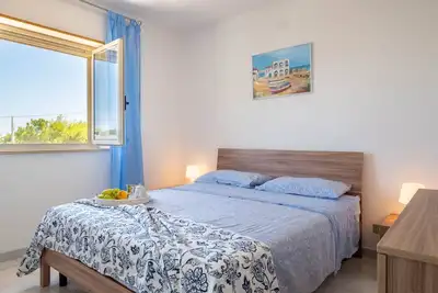 Image de Appartement 'Villetta Cara Mia, Costa Merlata' avec terrasse privée, jardin privé et climatisation
