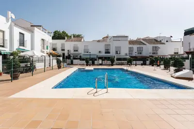 Image de Appartement 'Benalmadenasol' avec piscine partagée, Wi-Fi et climatisation