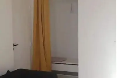 Image de Chambre comme un studio autonome dans une maison