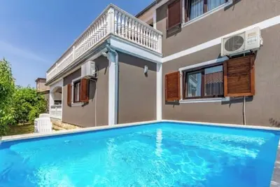 Image de Schönes Apartment mit 3 Schlafzimmer und Pool Mitbenutzung
