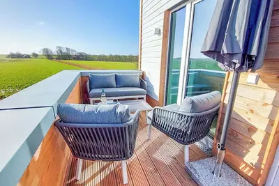 Deichbude Tossens - Modernes Ferienhaus für 4 Personen