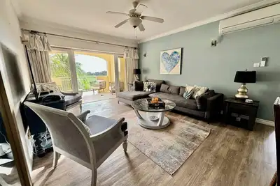 2 \/Bed Condo, w\/Ac, Pools, Rooftop patio, 5 Min to Beach, in a gated community.