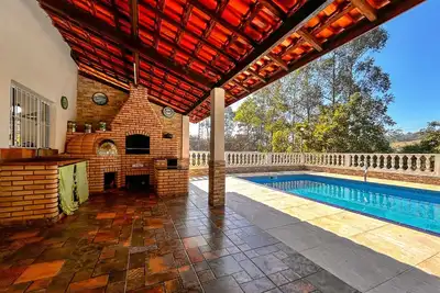 Image de Casa de campo com Wi-Fi, piscina e churrasqueira