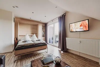 Image de Appartement 'Hexe I - Mit Blick Auf Den Wurmberg' avec vue sur la montagne, balcon et Wi-Fi