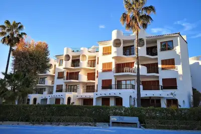Image de Apartment with roof terrace and balcony directly by the sea in Port d' Alcudia.