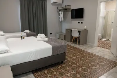 Image de Dana Rooms Quad room with bathroom with breakfast room as common space
