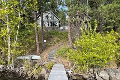 Image de Luxe, lakefront home with dock, amazing lake views, patio & fireplace