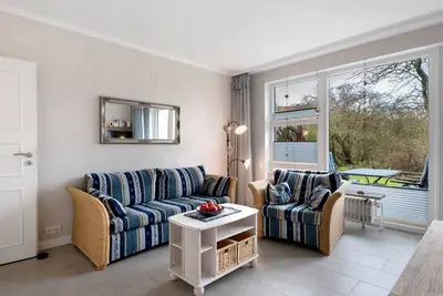 Image de Appartement \"Am Südstrand\" avec terrasse privée, jardin partagé et Wi-Fi