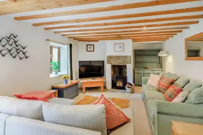 Image de The Wool Barn is a charming three-bedroom holiday home in Moretonhampstead, sleeping seven.