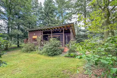 Image de Belle maison en bois Ă la campagne
