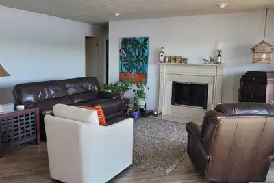 Image de 2 bedroom River front condo, balcony with open view, fireplace and open space