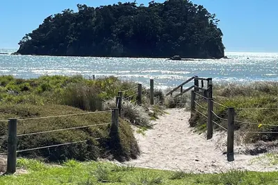 Image de Mount Maunganui- centrally located retro bach right across road from the beach
